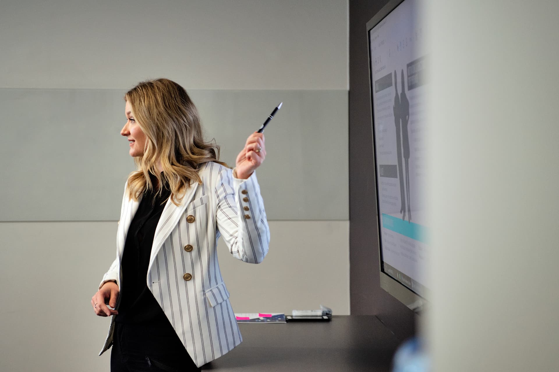 Tahnee Sharp presenting the Open Marketing Model on a meeting-room screen