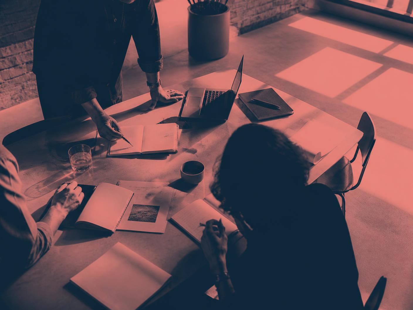 Independent marketers collaborating around a shared table
